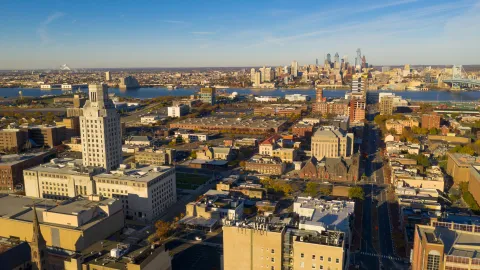 View of Camden, Delaware River and Philadelphia skyline in the distance.