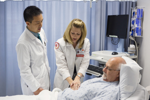 doctors pressing on patient stomach